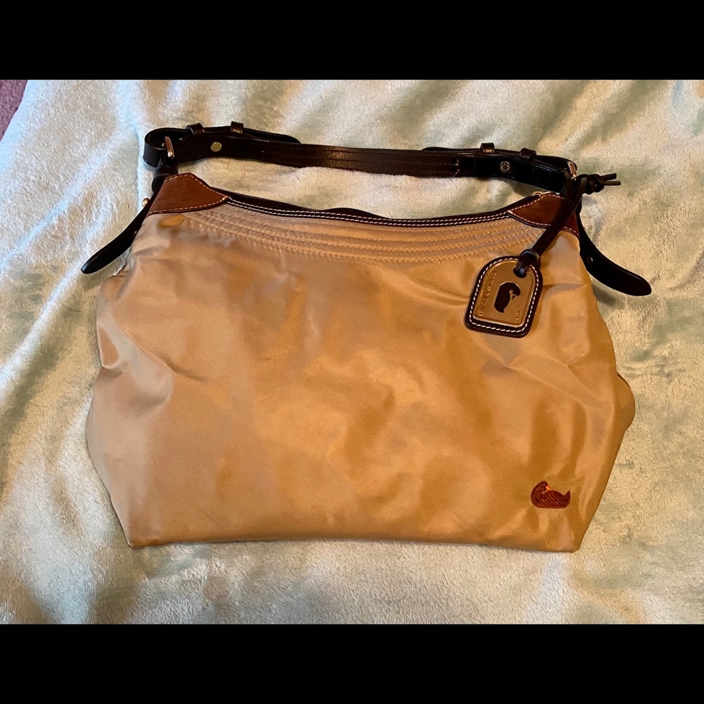 Dooney and Bourke fabric bag. Leather strap.
